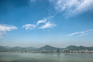 Qiantang River, hills and high rises of Hangzhou, Zhejiang, China, Asia Qiantang River, hills and high rises of Hangzhou, Zhejiang, China, Asia