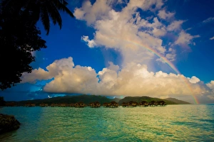 Rainbow arcing over the overwater bungalows, Le Taha'a Resort, Tahiti Rainbow arcing over the overwater bungalows, Le Taha'a Resort, Tahiti
