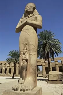 Ramses II and daughter Bant Anta, in forecourt of the temple of Karnak