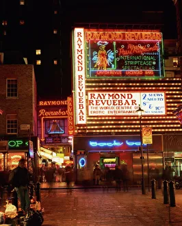 The Raymond Revuebar with neon signs in red light area at night, Soho, London The Raymond Revuebar with neon signs in red light area at night, Soho, London