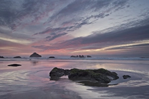 Red clouds, sea stacks, and rocks at sunset, Bandon Beach, Oregon, United States of America, North America Red clouds, sea stacks, and rocks at sunset, Bandon Beach, Oregon, United States of America, North America