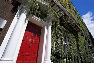 Doors Gallery: Red door and ivy covered building, St