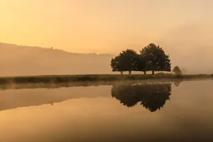 Reflections in River Derwent, dawn and autumn mist, Chatsworth Park, Peak District National Park Reflections in River Derwent, dawn and autumn mist, Chatsworth Park, Peak District National Park