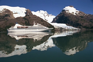 Reflections of the Seabourn Pride cruise ship, mountains and glacier in Chilean Fjordland Reflections of the Seabourn Pride cruise ship, mountains and glacier in Chilean Fjordland