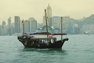 Hong Kong Collection: One of the last remaining Chinese junk boats sails on Victoria Harbour