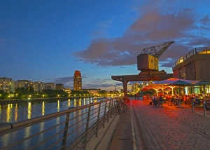 Restaurant beneath old dockyard crane by River Main, Frankfurt-am-Main, Hesse, Germany Restaurant beneath old dockyard crane by River Main, Frankfurt-am-Main, Hesse, Germany