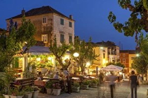 Restaurants at dusk, Makarska, Dalmatian Coast, Croatia, Europe Restaurants at dusk, Makarska, Dalmatian Coast, Croatia, Europe