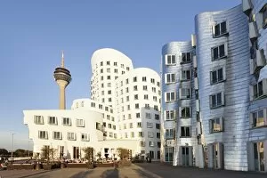 Images Dated 28th September 2011: Rheinturm tower and Gehry Haus building, Medienhafen, Dusseldorf, North Rhine-Westphalia, Germany