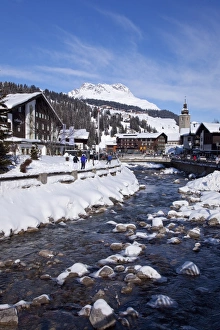 River and village church Lech, near St. Anton am Arlberg in winter snow River and village church Lech, near St. Anton am Arlberg in winter snow