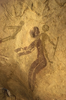 Rock paintings of decorated woman and children on cave, Tassili n'Ajjer Rock paintings of decorated woman and children on cave, Tassili n'Ajjer
