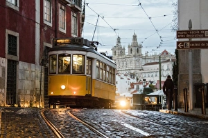 Romantic atmosphere in the old streets of Alfama with the castle in the background Romantic atmosphere in the old streets of Alfama with the castle in the background