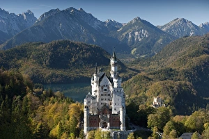 Romantic Neuschwanstein Castle and German Alps in autumn, southern part of Romantic Road Romantic Neuschwanstein Castle and German Alps in autumn, southern part of Romantic Road