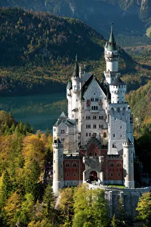 Romantic Neuschwanstein Castle and German Alps during autumn Romantic Neuschwanstein Castle and German Alps during autumn