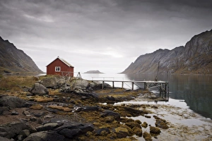Rorbu (fishermans hut) and jetty on fjord, Lofoten Islands, Norway Rorbu (fishermans hut) and jetty on fjord, Lofoten Islands, Norway