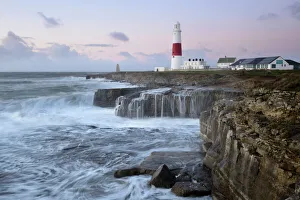 Rough seas crash over rocks near Portland Bill Lighthouse, Dorset, England, United Kingdom Rough seas crash over rocks near Portland Bill Lighthouse, Dorset, England, United Kingdom