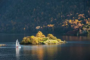 Prints of Sailing dinghy passes Norfolk Island, Lake Ullswater, Lake District National Park, Cumbria, England, United Kingdom, Europe Lake Prints: Sailing Dinghy Print: Norfolk Island to Lake Ullswater