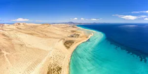 Sand beach of Costa Calma washed by turquoise sea, aerial view, Jandia Nature Park Sand beach of Costa Calma washed by turquoise sea, aerial view, Jandia Nature Park