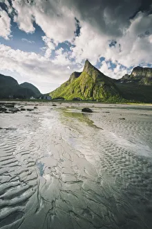 Empty sand beach with majestic Hatten mountain in the background, Ersfjord, Senja island Empty sand beach with majestic Hatten mountain in the background, Ersfjord, Senja island