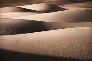 Sand dunes details of lights and shadows in the Sahara Desert, Merzouga, Morocco Sand dunes details of lights and shadows in the Sahara Desert, Merzouga, Morocco