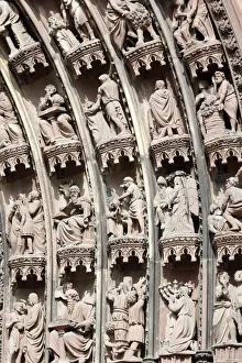 Scenes from the Old and New Testaments on the arches of the western front of Our Lady of Scenes from the Old and New Testaments on the arches of the western front of Our Lady of