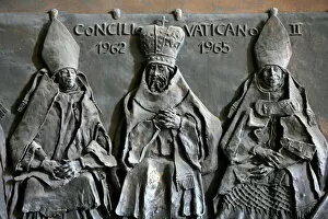 Depiction Gallery: Sculpture of the Vatican II Council on the door of St. Peters Basilica