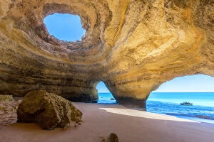 Portuguese Gallery: The sea caves of Benagil with natural windows on the clear waters of the Atlantic Ocean
