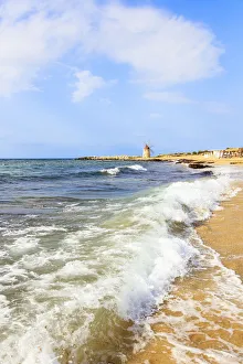 Sea waves crashing on sand beach of Baia dei Mulini, Trapani, Sicily, Italy, Mediterranean Sea waves crashing on sand beach of Baia dei Mulini, Trapani, Sicily, Italy, Mediterranean