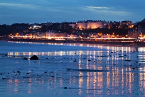 Images Dated 10th January 2014: Seafront illuminations reflected on wet sands, Filey, North Yorkshire, England, United Kingdom