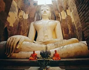 Buddhist Architecture Collection: Seated Buddha and monks meditating