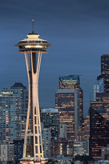 Seattle city skyline at night with illuminated office buildings and Space Needle
