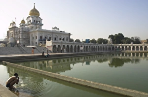 Sikh pilgrim bathing in the pool of the Gurudwara Bangla Sahib temple Sikh pilgrim bathing in the pool of the Gurudwara Bangla Sahib temple