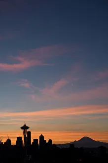 Silhouette of Seattle skyline with moon and Mount Rainier in distance, taken from Kerry Park, Seattle, Washington State Silhouette of Seattle skyline with moon and Mount Rainier in distance, taken from Kerry Park, Seattle, Washington State
