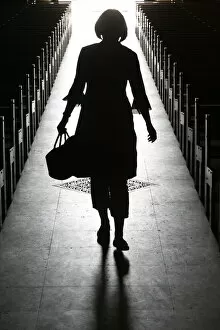 Images Dated 18th August 2007: Silhouette of a woman in church