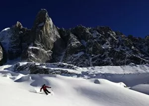 Skier Gallery: A skier enjoying perfect powder snow on the celebrated Pas de Chevre off-piste run