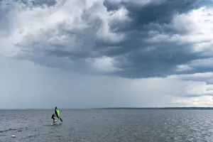 Skip Brown wind surfing into some weather on Sebago Lake, Maine, United States of America Skip Brown wind surfing into some weather on Sebago Lake, Maine, United States of America