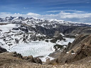 Snow-capped mountains and a frozen lake near Beartooth Pass, Wyoming Snow-capped mountains and a frozen lake near Beartooth Pass, Wyoming