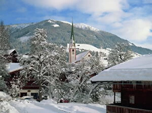 Related Images Gallery: Snow covers the village and church of Alpbach in the Tyrol in the winter, Austria, Europe