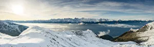 Snowcapped mountains surrounding Alpe Rogneda and Orobie Alps during a misty sunrise in Snowcapped mountains surrounding Alpe Rogneda and Orobie Alps during a misty sunrise in