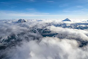 Sorapis group and Antelao emerging from clouds, aerial view, Dolomites, Belluno province Sorapis group and Antelao emerging from clouds, aerial view, Dolomites, Belluno province