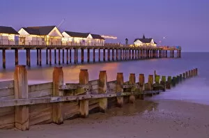 Wooden Collection: Southwold pier and wooden groyne at sunset, Southwold, Suffolk, England