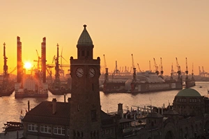 St. Pauli Landungsbruecken pier against harbour at sunset, Hamburg, Hanseatic City St. Pauli Landungsbruecken pier against harbour at sunset, Hamburg, Hanseatic City