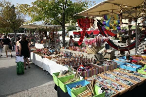 Small Group Of People Collection: Stalls in the street market held every Sunday in Ile sur la Sorgue, Provence, France, Europe