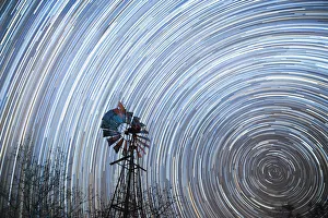 Startrail with windmill in foreground, Timbavati, South Africa, Africa Startrail with windmill in foreground, Timbavati, South Africa, Africa
