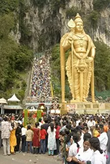 Statue of Hindu deity with pilgrims walking 272 steps