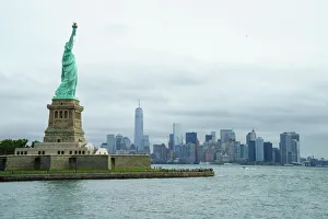 Statue of Liberty with the Lower Manhattan skyline and One World Trade Center beyond, New York City, New York Statue of Liberty with the Lower Manhattan skyline and One World Trade Center beyond, New York City, New York