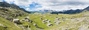 Stone huts and Rifugio Cristina surrounded by Rhaetian Alps, Alpe Prabello, Valmalenco Stone huts and Rifugio Cristina surrounded by Rhaetian Alps, Alpe Prabello, Valmalenco
