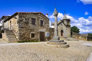 Stone pillory and Main Church, Idanha-a-Velha village, Serra da Estrela, Beira Alta, Portugal, Europe Stone pillory and Main Church, Idanha-a-Velha village, Serra da Estrela, Beira Alta, Portugal, Europe