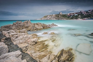 Storm clouds frame the village overlooking the turquoise sea, Santa Teresa di Gallura Storm clouds frame the village overlooking the turquoise sea, Santa Teresa di Gallura