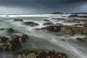 Stormy conditions on the rocky Bantham coast in autumn, looking across to Burgh Island Stormy conditions on the rocky Bantham coast in autumn, looking across to Burgh Island