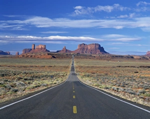 Straight road heading for Monument Valley, Navajo Reserve, on border of Arizona and Utah Straight road heading for Monument Valley, Navajo Reserve, on border of Arizona and Utah